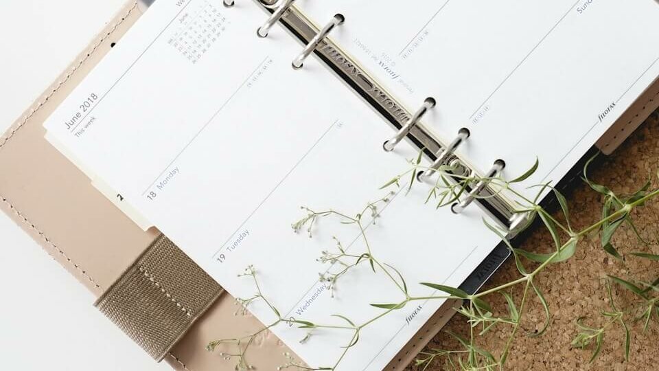 white and browm notebook